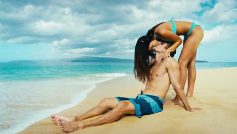 Happy-couple-in-love-playing-on-the-beach-in-slow-motion