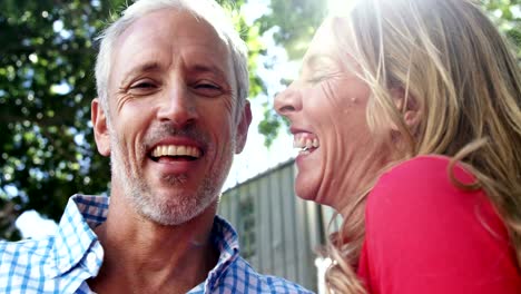 Mature-couple-is-embracing-and-laughing-in-the-street