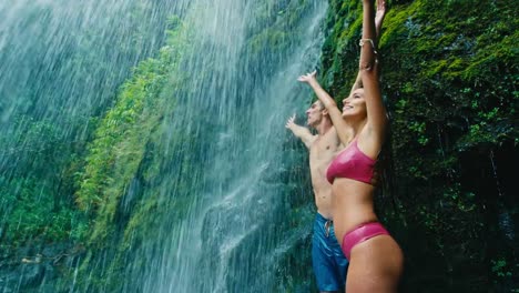 Couple-Relaxing-Under-Waterfall