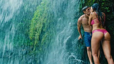 Couple-Relaxing-Under-Waterfall