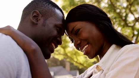 Low-angle-view-of-couple-embracing-and-talking