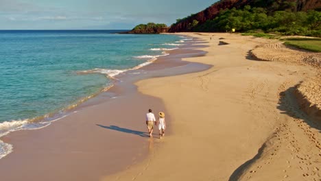 Happy-Retired-Couple-Walking-Down-the-Beach