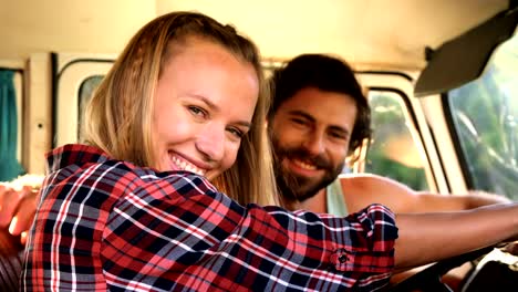 Hipster-couple-sitting-in-a-van