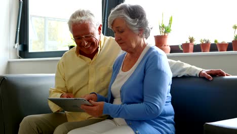 Senior-couple-using-digital-tablet