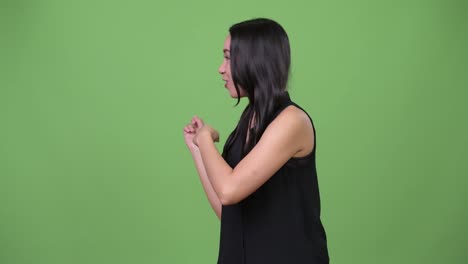 Young-beautiful-Asian-businesswoman-talking-to-camera