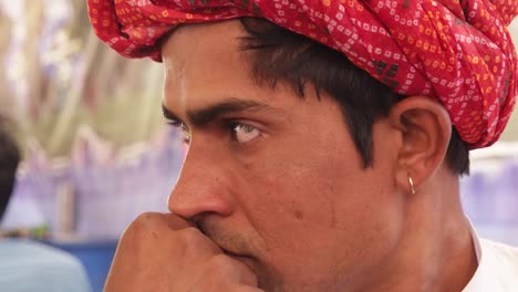 Portrait-of-a-Rajasthani-young-male-in-red-turban-in-Pushkar,-India