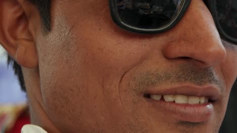 Extreme-closeup-of-a-handsome--dude-male-wearing-dark-glasses,-smug,-sexy-and-confident-in-Rajasthan,-India