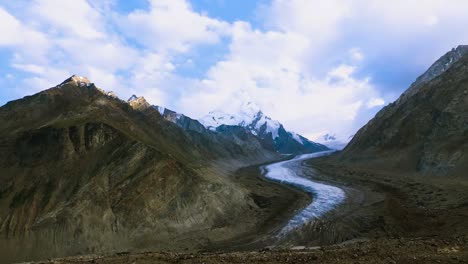 Beautiful-landscpe-of-Drang-Drung-Glacier-with-flowers,-Mountain-glacier-on-zanskar-road-at-Himalaya-Range,-Zanskar-Range,-Pensi-La,-Jammu-and-Kashmir,-Ladakh-India.