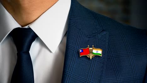 Businessman-Walking-Towards-Camera-With-Friend-Country-Flags-Pin-Taiwan---India