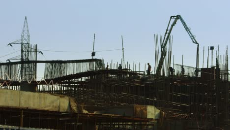 Time-Lapse-shot-of-manual-workers-working-at-a-construction-site