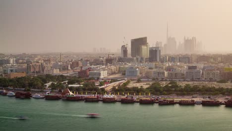 dubai-city-sunset-downtown-deira-roof-top-creek-panorama-4k-time-lapse-united-arab-emirates