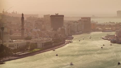 dubai-sunset--deira-creek-water-traffic-roof-top-panorama-4k-time-lapse-united-arab-emirates