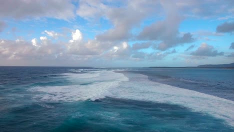 Seascape-with-foamy-waves-of-blue-Indian-Ocean,-aerial-view