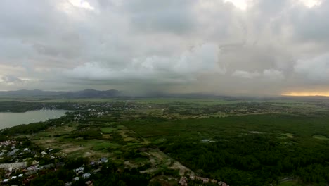 Flying-over-Mauritius-Island-with-low-clouds