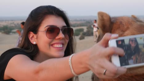 Taking-a-selfie-with-camel-in-desert