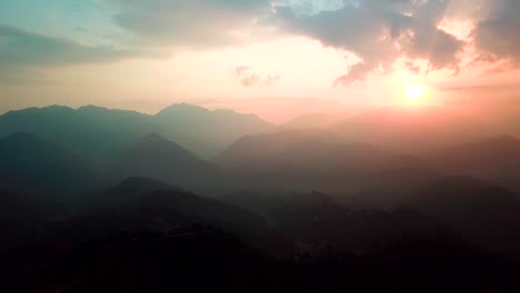 Sunset-above-valley-in-the-Himalaya-mountains,-Nepal