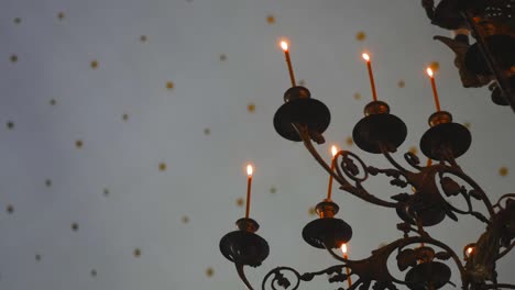 Candle-flame-close-up-in-the-Indian-Temple-on-a-Religious-Festival-Diwali.-Oil-Lamp-in-Beautiful-candlestick.-Spiritual,-Mystical-and-Religious-Traditions-of-India.-Beautiful-bright-festive-lights