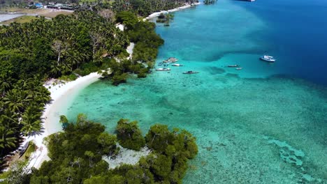 Aerial-view-of-a-crystal-clear-blue-water-beach-in-Havelock,-Andaman-and-Nicobar-Island,-India