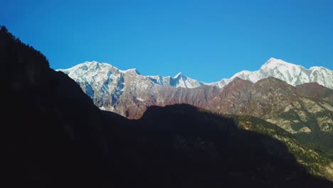 Sunrise-above-peak-in-the-Himalaya-range,-Nepal