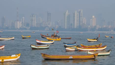 Indian-fisherman-sailing-a-fishing-boat-through-other-parked-fishing-boats