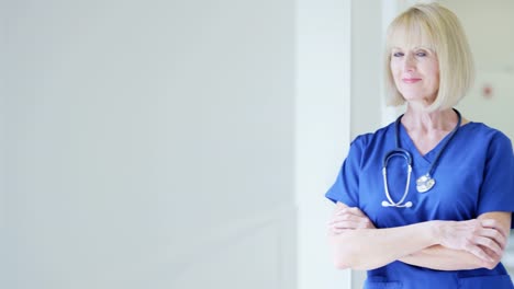 Portrait-of-Caucasian-senior-female-nurse-in-hospital