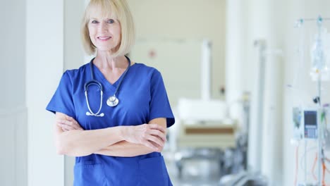 Portrait-of-Caucasian-female-hospital-doctor-wearing-scrubs