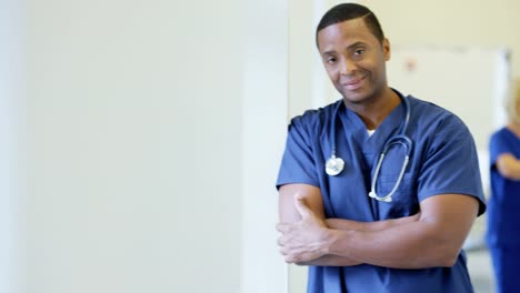 Portrait-of-African-American-male-nurse-in-hospital