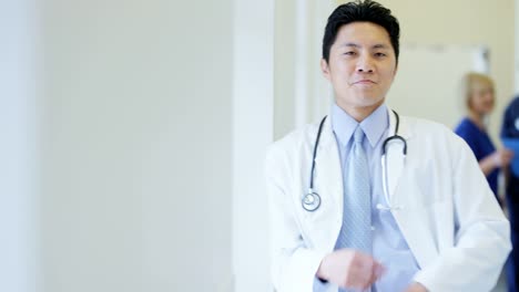 Portrait-of-Asian-American-male-staff-medical-centre