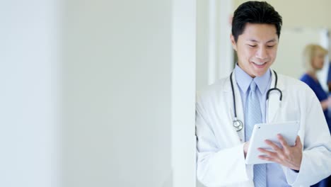 Portrait-of-ethnic-male-doctor-working-on-technology