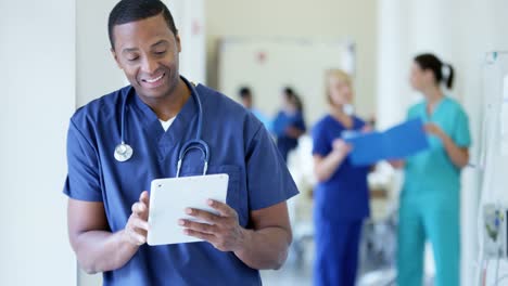 Portrait-of-ethnic-male-staff-working-on-tablet