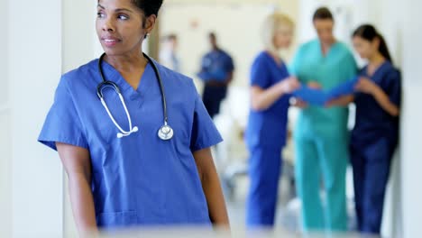 Portrait-of-ethnic-female-nurse-in-medical-center