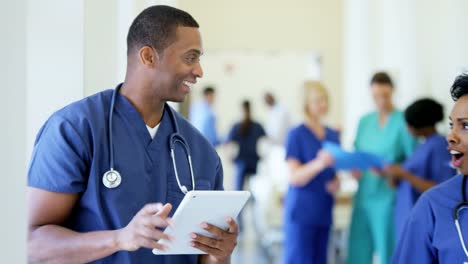 Portrait-of-African-American-male-nurse-using-tablet