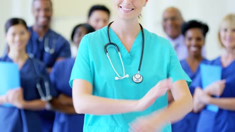 Portrait-of-Caucasian-young-female-nurse-and-team