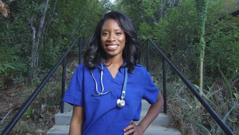 Beautiful-black-woman-in-scrubs-smiling-at-the-camera