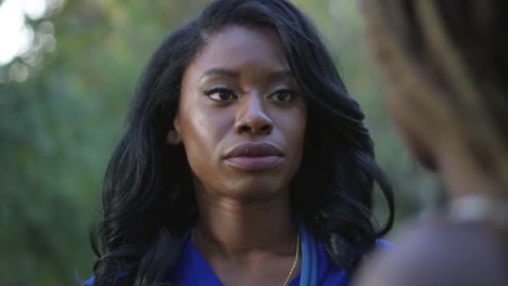 Slow-motion-close-up-shot-of-beautiful-black-nurse-talking-to-a-patient