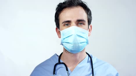 close-up-portrait-of-a-surgeon-or-doctor-with-mask-and-headset-ready-for-operation-in-hospital-or-clinic.-The-surgeon-smiles-safe-and-proud-of-himself.