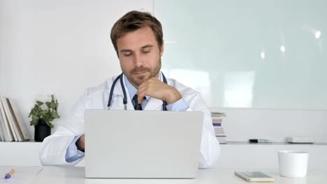 Pensive-Doctor-Sitting-in-Clinic-and-Thinking