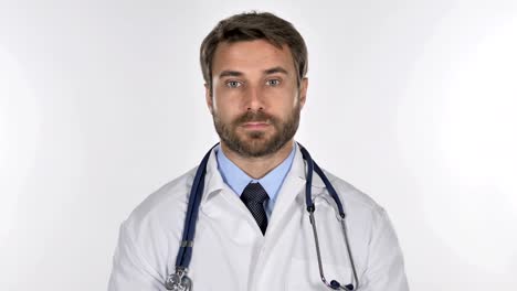 Doctor-Looking-at-Camera-in-Studio-on-White-Background