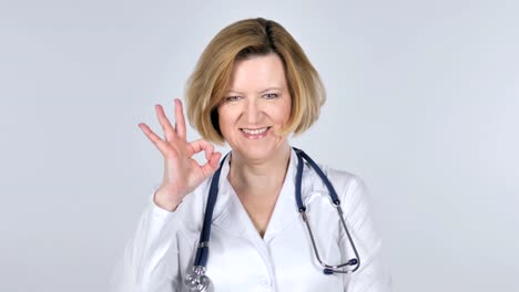 Portrait-of-Old-Doctor-Gesturing--Okay-Sign