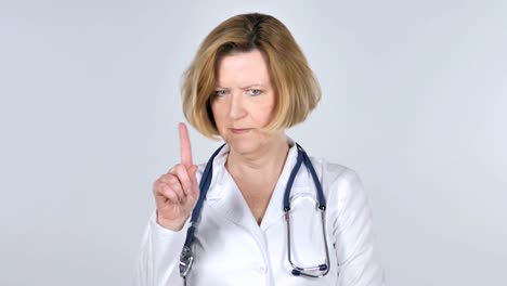 Portrait-of-Old-Doctor-Waving-Finger-to-Refuse