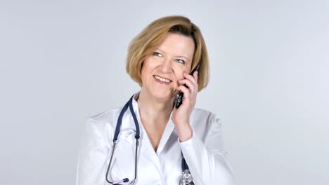 Old-Doctor-Talking-on-Smartphone,-White-Background