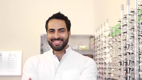 Optician-Doctor-Near-Showcase-With-Eyeglasses-At-Glasses-Shop