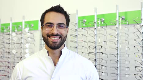 Optician-Doctor-Near-Showcase-With-Eyeglasses-At-Glasses-Shop