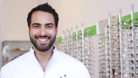 Optician-Doctor-Near-Showcase-With-Eyeglasses-At-Glasses-Shop