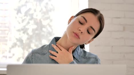 Close-Up-of-Tired-Young-Girl-with-Neck-Pain-at-Work