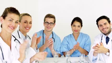 Medical-team-applauding-at-the-camera