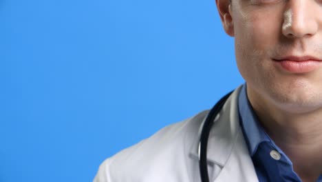 Studio-Shot-Of-Male-Doctor-Wearing-White-Coat