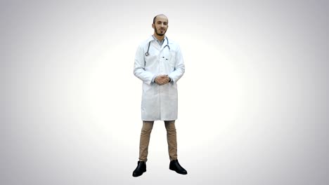 Smiling-male-doctor-talking-to-the-camera-on-white-background