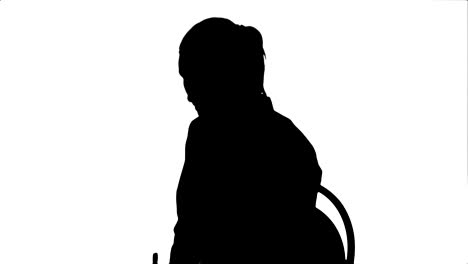 Silhouette-Female-doctor-talking-with-patient-and-writing-a-recipe