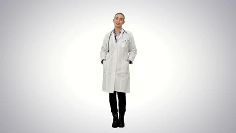 Smiling-beautiful-woman-in-lab-coat-talking-to-the-camera-on-white-background